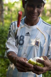 Peels a Toronja, a citrus fruit of the jungle.