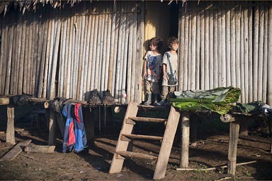 Boys look outside, our jungle hut.