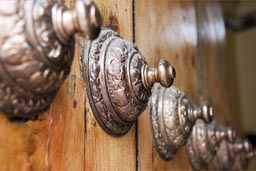 The bigger the door nails are the richer the owner, these are on the cathedral's portal, Trujillo, Peru.