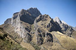 The Cordillera Blanca rocky ranges. Just before Antamina mine Peru. The dust from the mine already rises behind.