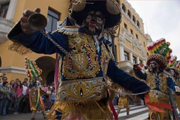 Chains and black facial costumes, signify slaves, Peru independence day.