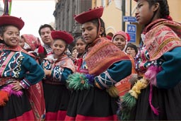 Girls red traditional Andean dress, Independence Day in Peru.
