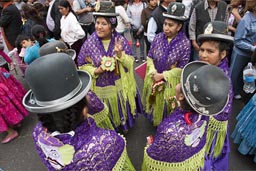 Traditionally dressed women from Puno wait till they dance, Independence Day in Lima, Peru. 