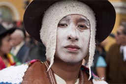 Hat and a white mask, men on Lima Independence Day in Peru. 