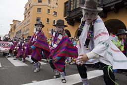 Traditional dances performed by a white masked group, Independence Day in Lima, Peru. Traditional dances performed by a white masked group, Independence Day in Lima, Peru.
