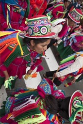 Women from Puno march and dance along parade on plaza de armas, Lima Independence Day in Peru. 