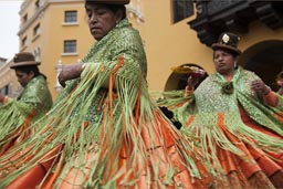 Bollera dresses, green and orange, so beautiful, women from Puno dance and turn on Independence Day, in Lima plaza de armas, Peru. Bollera dresses, green and orange, so beautiful, women from Puno dance and turn on Independence Day, in Lima plaza de armas, Peru.