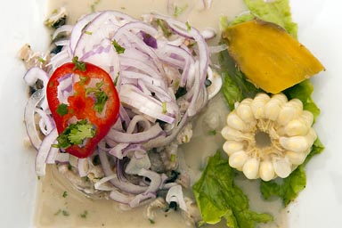 In Paracas, very nice, spicy seafood and fish ceviche, sweat potatoe and corn. Peru.