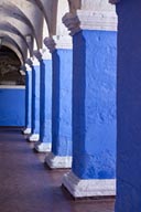 Blue thick columns, white arcades, paintings on ceiling, Santa Catalina, convent, Arequipa.