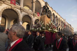 Statue of a Saint is carried around plaza de armas, procession of church in Arequipa. Christian fiesta.