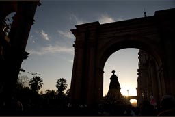 Statue of redeemer is carried under arch of cathedral in Arequipa, plaza de armas, Peru. 