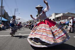 It lasts forever, the folkloric dance groups come one after the other, 100+ dancers each. The music is Andino, Arequipa Day, Peru.