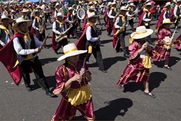 Red marching band on la Avenida de Independencia, Arequipa Day, Peru.