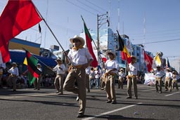 Parade and wave the red flag, Lots of flags on Arequipa Day.