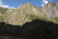 From Vilcanota valley the cliffs rise 1,000m, on top somewhere is Machu Picchu.