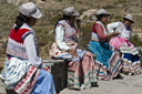 Mirador, Cruz del Condor, 4 traditionally dressed Indigenous women. Peru.
