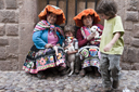 In Cusco, cobble stones and indigenous women in traditional dress, the boys like their lambs and I take a photo for a dollar. In Cusco, cobble stones and indigenous women in traditional dress, the boys like their lambs and I take a photo for a dollar.