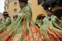 Bollera dresses, green and orange, so beautiful, women from Puno dance and turn on Independence Day, in Lima plaza de armas, Peru.