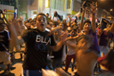 Tumbes, football cup victory celebrations in street at night.