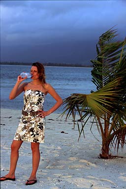 Agnieszka and Evian next to a palm tree catching the last sun of the day