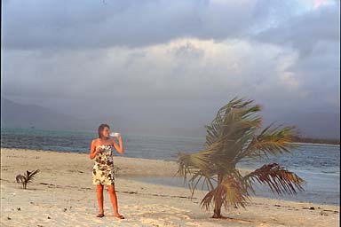 Agnieszka and Evian next to a palm tree catching the last sun of the day