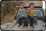 Daniel and David on Bonnet of Land Rover 6x6x, on way to Casamance Senegal, eating Bananas.