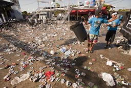 Empty cans, trash piles after the carnival, Las Tablas, Panama.